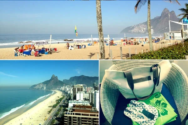 Imagem de uma bela praia no Rio de Janeiro com areia dourada, mar azul e montanhas ao fundo, uma estrutura de guarda-sol e pessoas aproveitando o dia ensolarado na praia .Viagens para Ipanema.
