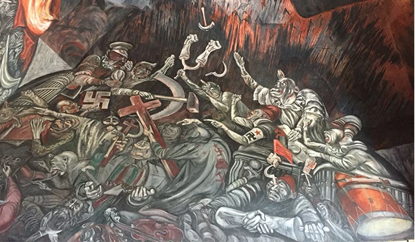 Detalhes de um mural que retrata cenas históricas relacionadas com cores escuras e personagens em movimento. O que fazer em Guadalajara.