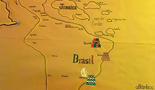 Mapa do Brasil destacando a importância do jogo de dominó com peças coloridas no centro da imagem, incluindo regiões como Jamaica e Mar do Caribe, em fundo amarelo.