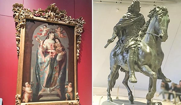 Imagem de uma pintura de Nossa Senhora com detalhes dourados ao redor e duas figuras de anjos na parte inferior. Ao lado, uma escultura de um cavaleiro em pé montado a cavalo, feita de material escuro.