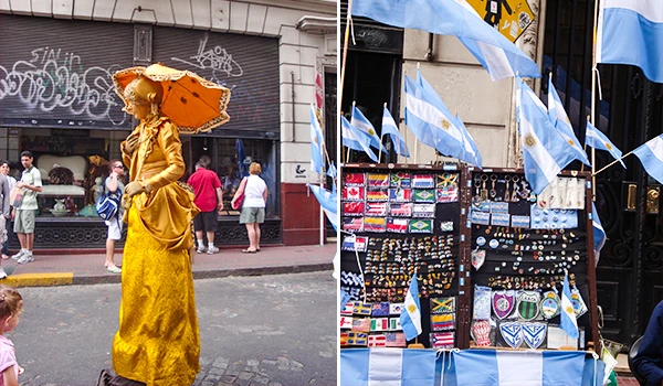 Imagem de uma celebração com várias bandeiras da Argentina e uma pessoa vestida com traje tradicional, simbolizando orgulho nacional em evento ao ar livre.