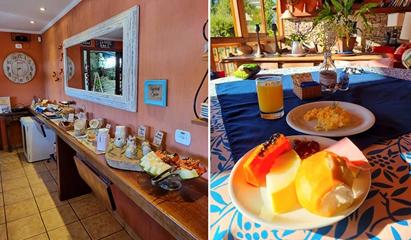 Imagem de um buffet de café da manhã completo com pães, frutas, queijos, sucos e uma mesa com comida e decoração de varanda com vista para o jardim.