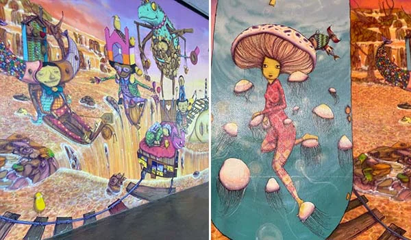 Imagem de um mural artístico colorido, dividido em três painéis, com criaturas fantásticas, seres híbridos e personagens surreais em um cenário que mistura natureza e fantasia. À esquerda, figuras excêntricas e estruturas imaginárias ocupam uma paisagem em tons quentes; no centro, uma personagem humanoide com cabeça em forma de cogumelo flutua entre pequenos cogumelos em um ambiente aquático azulado; à direita, aparecem elementos orgânicos e criaturas fantásticas em uma paisagem alaranjada. As cores vibrantes e os traços detalhados conferem à obra uma atmosfera lúdica e onírica.