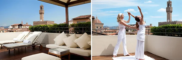 Terraço elegante de hotel com espreguiçadeiras e sofás brancos, tendo ao fundo a paisagem de Florença e a torre do Palazzo Vecchio. Ao lado, duas mulheres vestidas de branco fazem uma atividade no terraço com vista para a cidade.