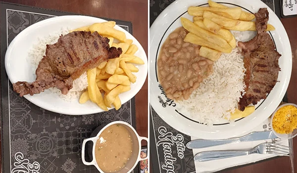 Prato com carne, arroz, feijão, batatas fritas e um copo com molho ou chimichurri, apresentando uma refeição típica brasileira diversas vezes apreciada.