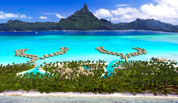 Vista aérea de um resort paradisíaco em uma ilha com cabanas sobre a água cristalina, cercada por vegetação e com uma montanha ao fundo, em uma paisagem tropical. Rota de Viagem para a Oceania.