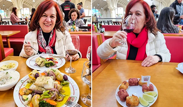 Deusa Rodrigues desfrutando de uma refeição e taça de vinho no restaurante Irmãos Gomes no Mercadão de São Paulo, com comida apetitosa.