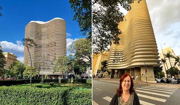 Edifício moderno de fachada ondulada, com várias fileiras horizontais de varandas, fotografado de dois ângulos em uma área urbana arborizada. À direita, uma mulher de cabelos ruivos aparece em primeiro plano diante do prédio. O céu está azul, com algumas nuvens.