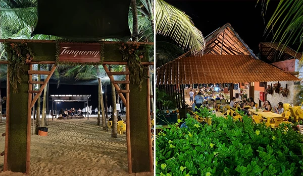 Imagem de uma área de praia à noite com entrada decorada, plantas tropicais, e um espaço com mesas amarelas, ideal para eventos e festas na areia.
