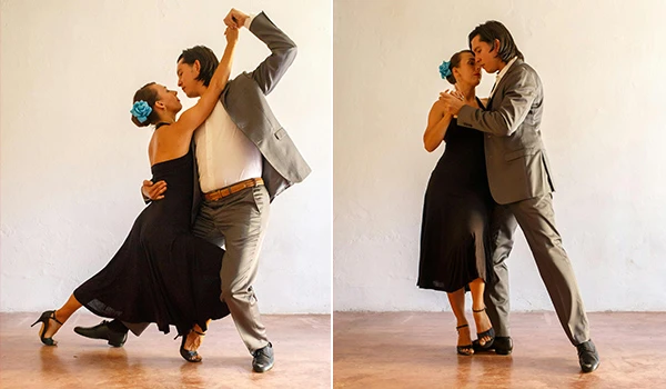 Casal de dança tango, mulher com vestido preto e rosa, homem com terno cinza, demonstrando paixão e elegância na dança, em fundo neutro.