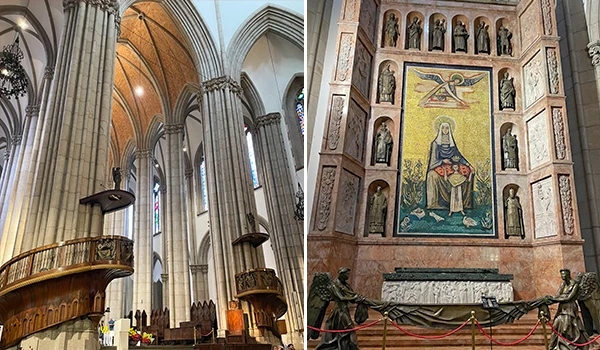 Interior de uma igreja gótica com altos vitrais e pilares imponentes, destacando a arquitetura clássico e elementos religiosos tradicionais.