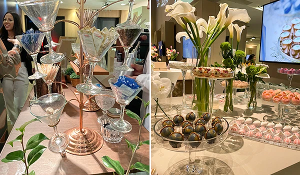 Decoração sofisticada de mesa com coquetéis, doces e flores em evento elegante. Display atrativo e requintado para recepção em um dos eventos sobre casamento em São Paulo.