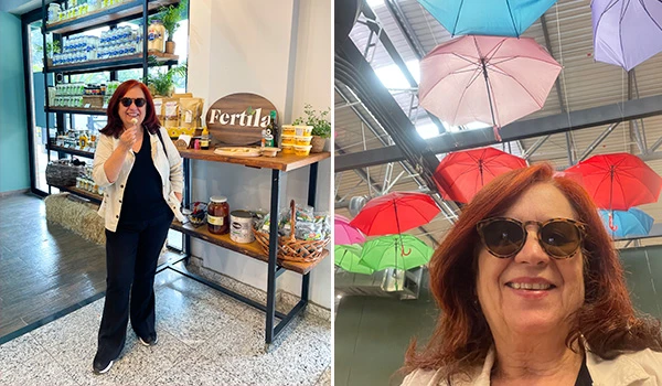 Deusa Rodrigues, visitando uma loja de produtos naturais e alimentos sustentáveis com produtos de fertilidade, ao lado de prateleiras com alimentos orgânicos.
