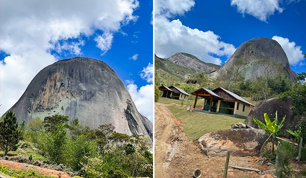 Vista panorâmica da Pedra Azul, com nuvens, rodeado por vegetação exuberante e casas próximas na Rota das Montanhas Capixabas.