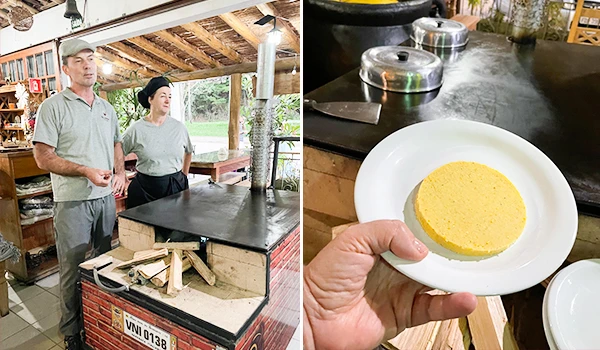 Imagem de um casal em uma cozinha rústica, preparando um prato típico italiano a pizza de Polenta na Rota das Montanhas Capixabas.