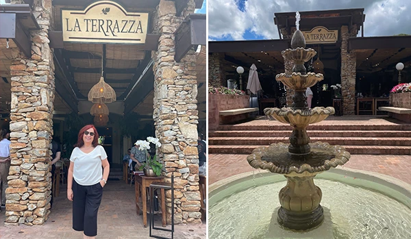 Fachada do restaurante La Terrazza com uma mulher na entrada e uma fonte decorativa em primeiro plano, mostrando um ambiente elegante e aconchegante.