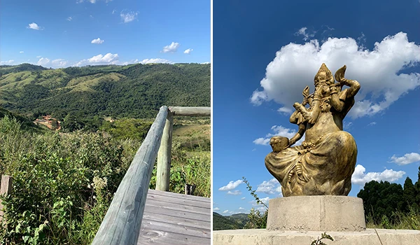 Paisagem de montanhas verdes com céu azul e estátua de Ganesha em um local tranquilo e espiritual. Uma combinação perfeita de natureza e cultura.