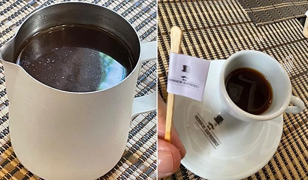 Imagem de uma caneca de café e um pequeno copo com café servido. A caneca é branca e o copo possui uma bandeirinha decorativa. Ótimo para amantes de café.