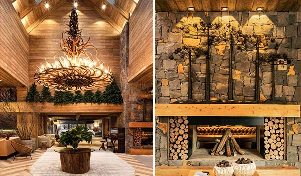 Imagem de interior de casa de campo com decoração rústica, incluindo uma luminária de galho, paredes de pedra, lareira de pedra e elementos naturais que criam um ambiente aconchegante e sofisticado. Um lugares para comemorar Bodas de Prata no Brasil.