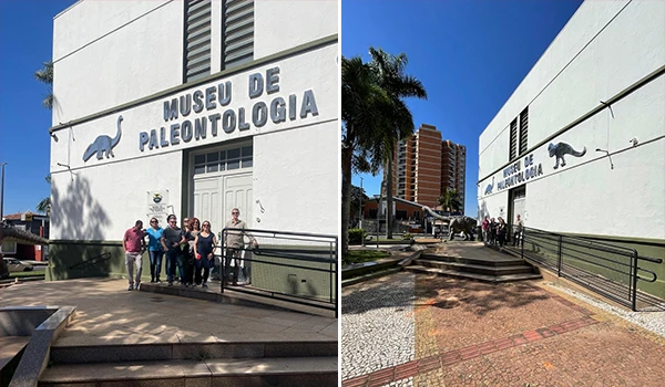 Visita ao Museu de Paleontologia com grupo de pessoas na frente da entrada, destaque para a fachada moderna e detalhes da arquitetura, com árvores ao redor. O que fazer em Marília.