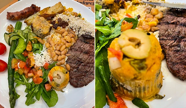 Imagem de um prato de comida contendo arroz, feijão, carne grelhada, salada e uma torta de milho com vegetais, destaque para a variedade de ingredientes frescos e coloridos. Restaurante Don Mantelli, o que fazer em Marília.