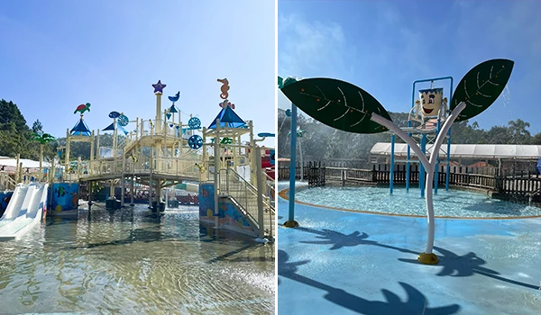 Área de recreação aquática infantil com escorregadores, brinquedos coloridos e uma piscina rasa adequada para crianças, com céu limpo ao fundo.