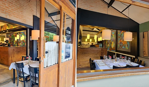 Imagem de um restaurante aconchegante e bem decorado, com mesas organizadas e iluminação confortável, ideal para gastronomia. Chalés em São Francisco Xavier.