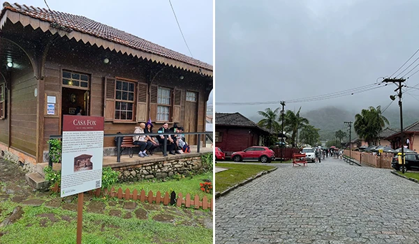 Imagem de uma rua e uma casa de madeira na zona rural, com moradores sentado e uma rua de paralelepípedos em um clima nublado, promovendo turismo rural e cultura brasileira.