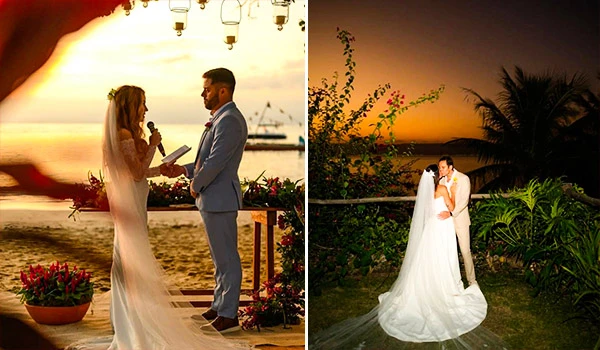 Casal se casando ao pôr do sol na praia, momento romântico de casamento ao ar livre com decoração floral. Imagem com céu alaranjado ao entardecer.