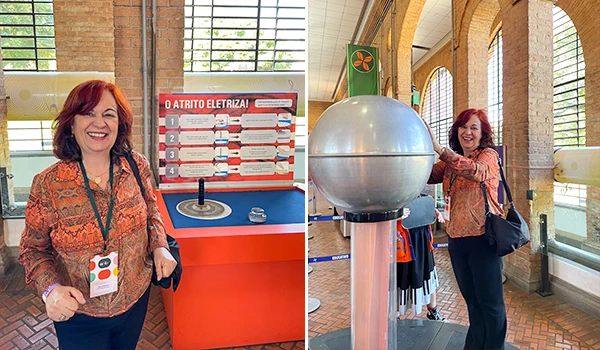 Deusa Rodrigues participando de uma atividade interativa relacionada a eletromagnetismo, com um painel explicativo e uma esfera metálica gigante. Atrações do Museu Catavento.