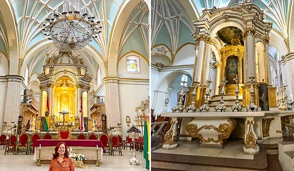 Interior da Catedral Metropolitana de Sucre, na Bolívia, com altar-mor ricamente ornamentado em dourado, colunas decoradas, imagens religiosas e teto abobadado com nervuras brancas e douradas. À esquerda, uma mulher posa diante do altar, sob um grande lustre de cristal.
